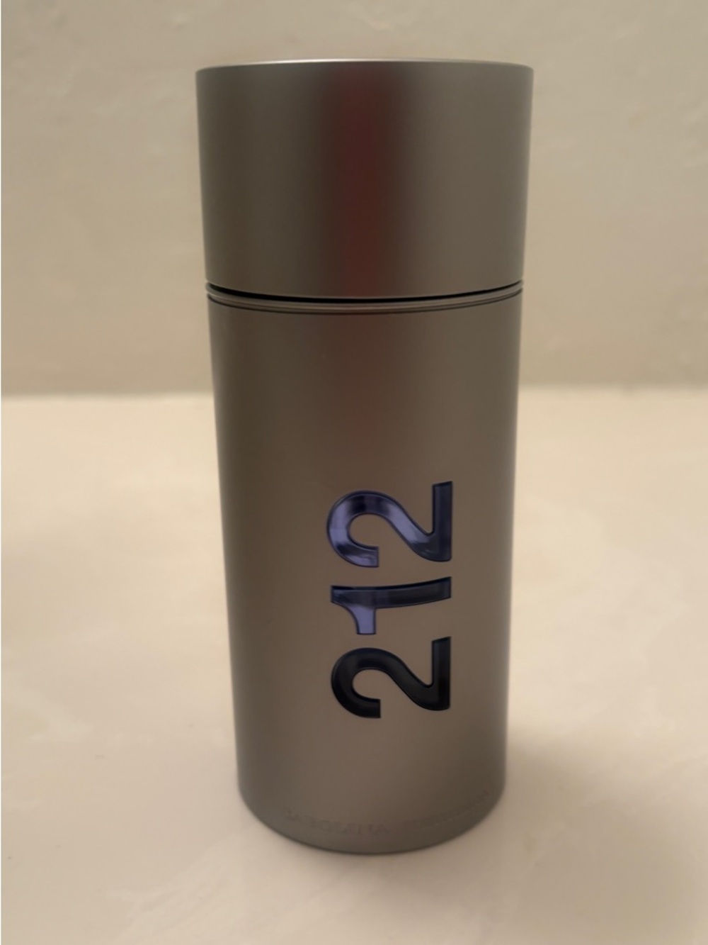 Carolina Herrera 212 Men Silver Bottle with Blue Logo